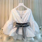 White V-neck blouse with puff sleeves and striped bow belt, elegant women's fashion top