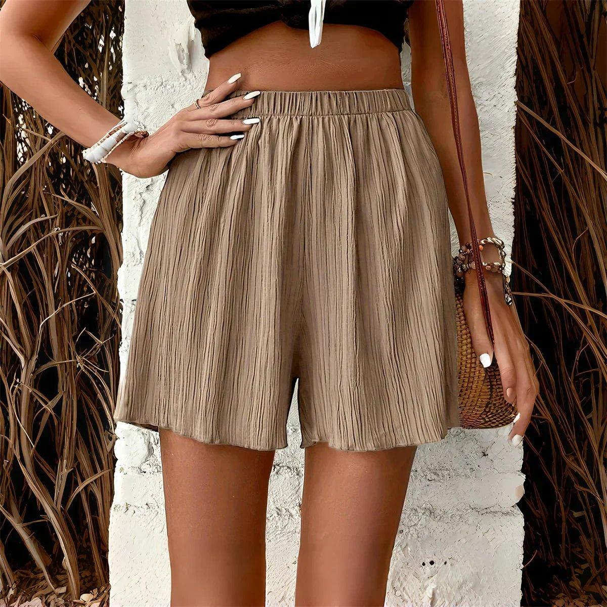 Beige pleated high-waist women's shorts with elastic waist, summer fashion outfit