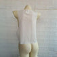 White sleeveless women's top on mannequin, back view, fashion store display