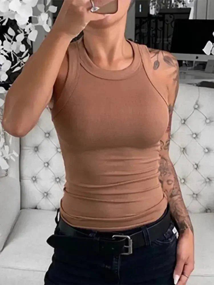 Women's fitted brown tank top with ruched detail, styled with black jeans and belt for casual fashion