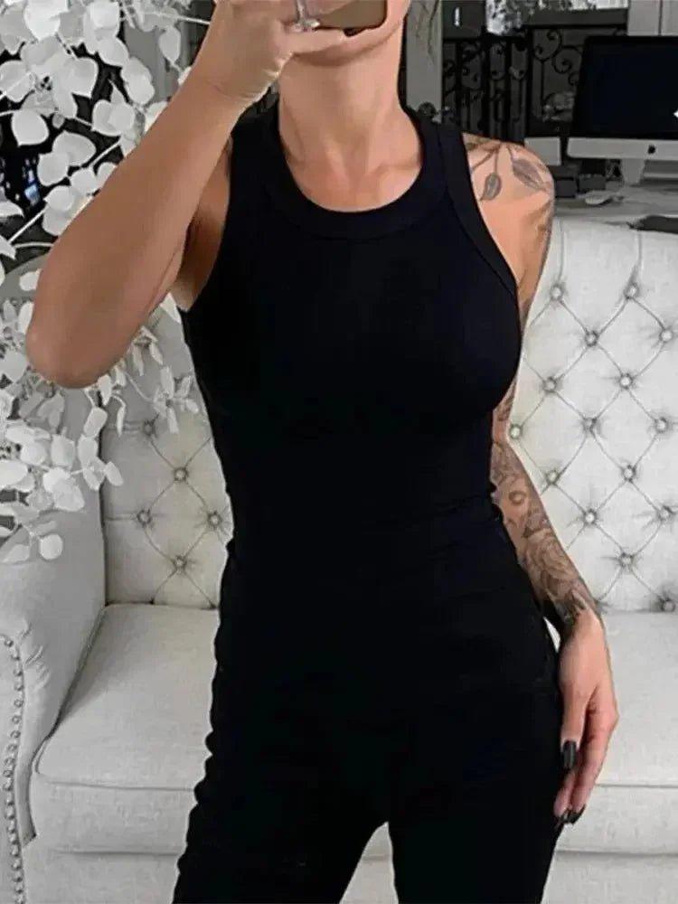 Woman in black sleeveless jumpsuit, stylish fashion outfit for everyday wear
