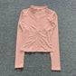 Pink women's long sleeve zip-up athletic top for fitness and yoga