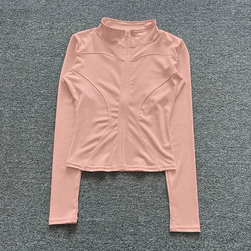 Pink women's long sleeve zip-up athletic top for fitness and yoga