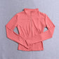 Pink women's long-sleeve zip-up athletic jacket for fitness and fashion