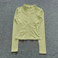 Light green women's long sleeve zip-up athletic top, perfect for fitness and active wear