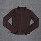 Brown women's zip-up athletic jacket with long sleeves and high collar, ideal for fitness and casual wear.
