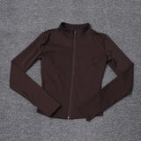 Brown women's zip-up athletic jacket with long sleeves and high collar, ideal for fitness and casual wear.