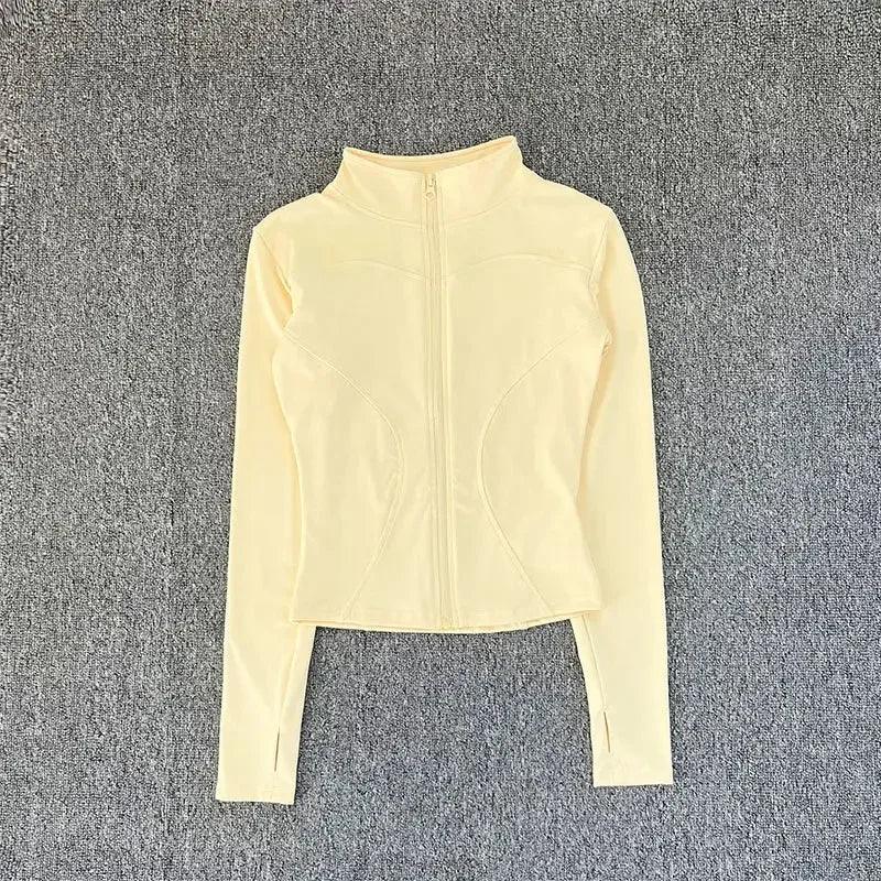 Cream long sleeve zip-up crop top for women's fashion and activewear