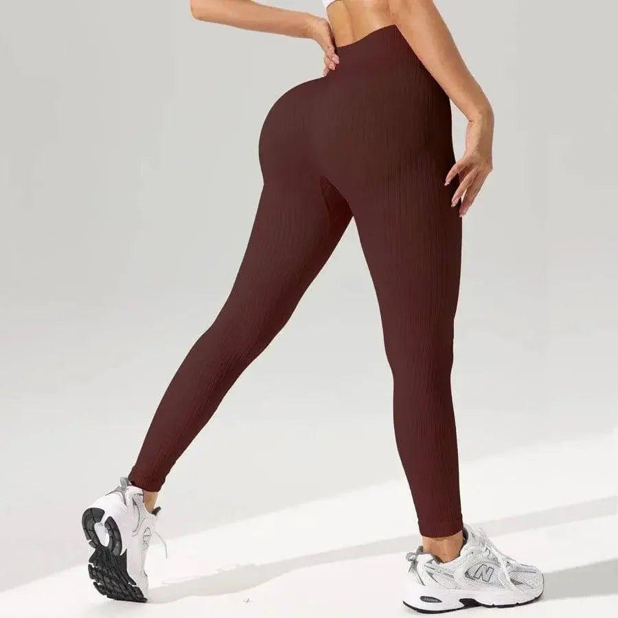 Women's high-waisted ribbed leggings with white sneakers, fitness fashion