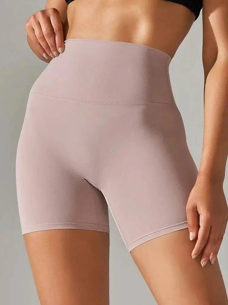 High-waisted women's bike shorts in soft pink, perfect for fashion and fitness