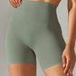 High-waisted olive green women's workout shorts for fitness and yoga