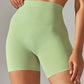 Light green high-waisted women's biker shorts for fitness and fashion