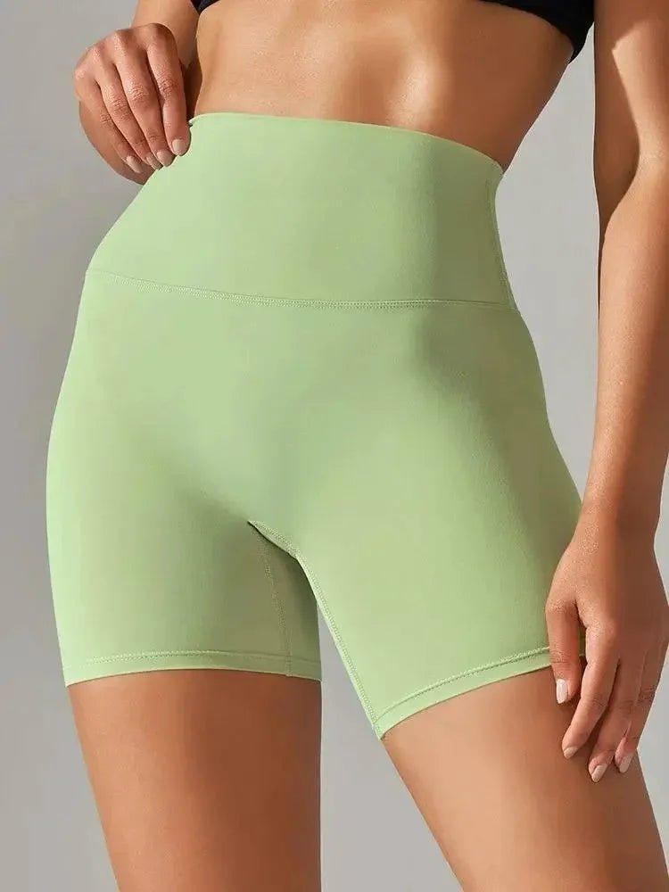Light green high-waisted women's biker shorts for fitness and fashion