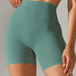 Teal high-waisted women's workout shorts for fitness and yoga