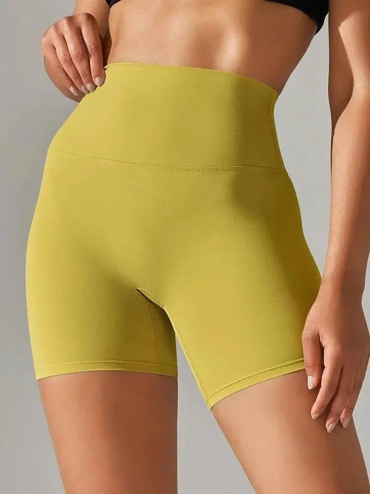 Yellow high-waisted women's biker shorts for fitness and fashion