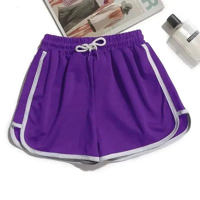 Purple women's athletic shorts with white side stripes and drawstring waist, ideal for casual or workout wear