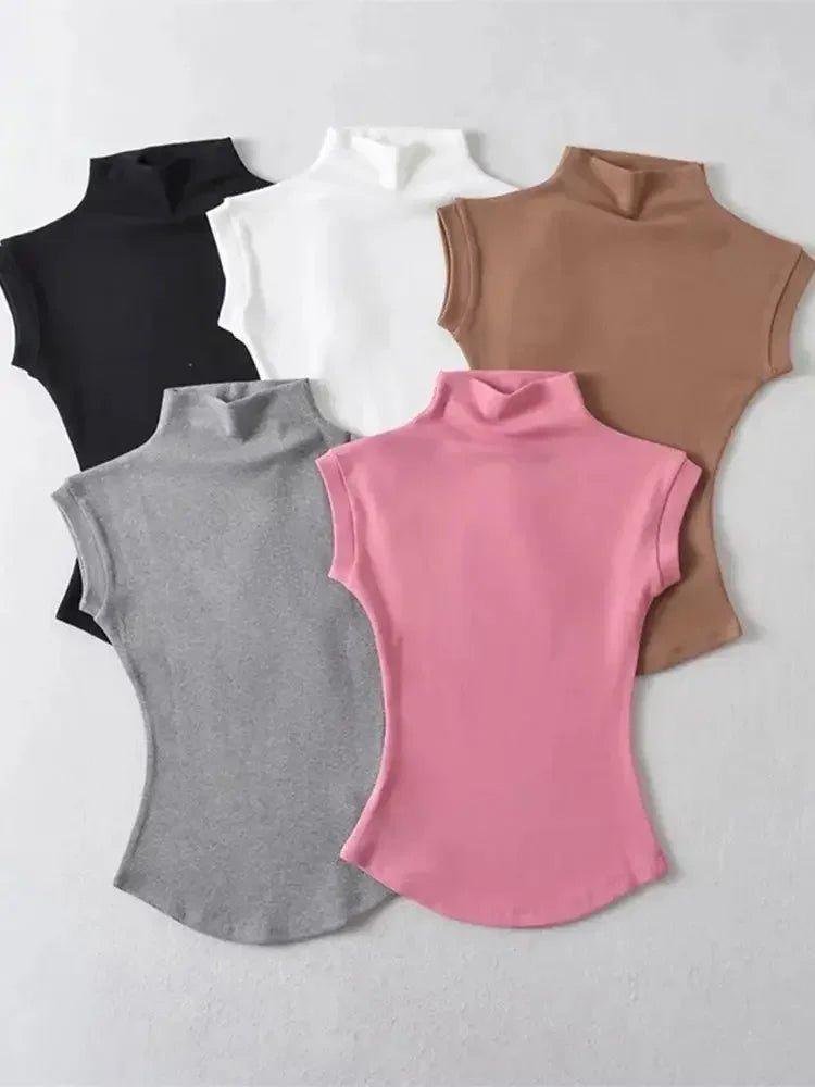 Women's sleeveless turtleneck tops in black, white, brown, gray, and pink — stylish fashion essentials