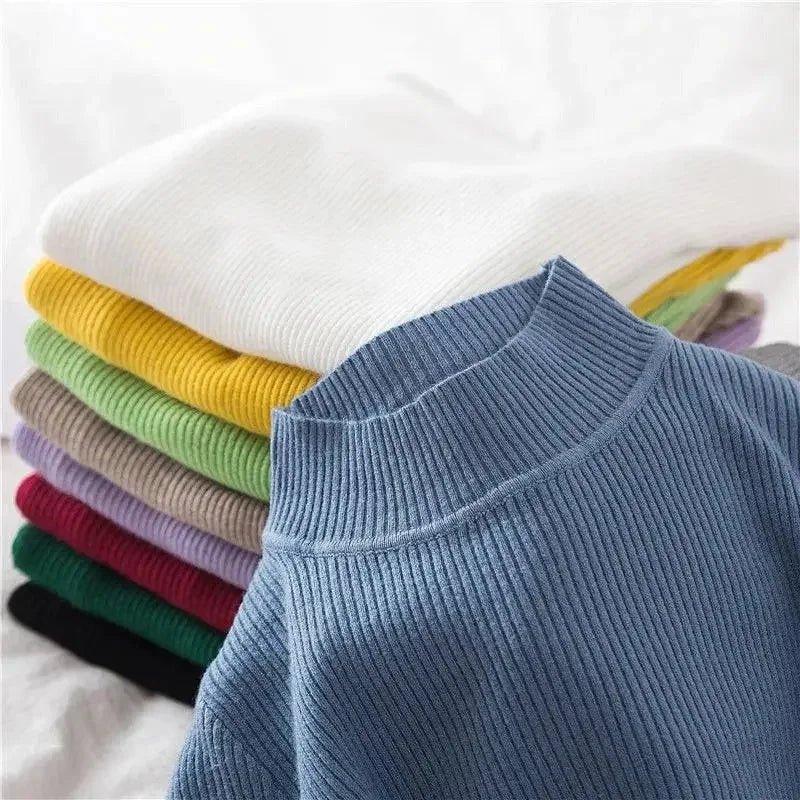 Women's ribbed knit sweater in blue, stacked with colorful fashion tops for casual wear