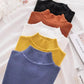 Women's ribbed turtleneck sweaters in black, rust, white, yellow, and blue, perfect for fashion layering.