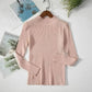 Pink ribbed long sleeve turtleneck sweater for women, fashion top on hanger with magazine backdrop