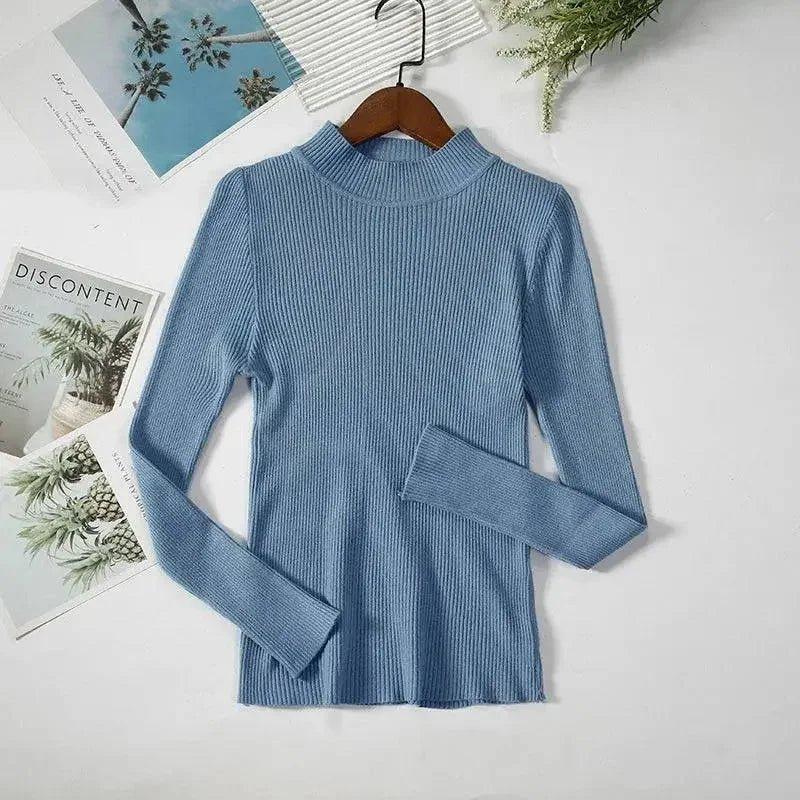 Blue ribbed long sleeve women's turtleneck top on hanger, fashion apparel