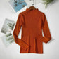 Rust orange ribbed turtleneck sweater for women, long sleeve fashion top on hanger with magazine backdrop