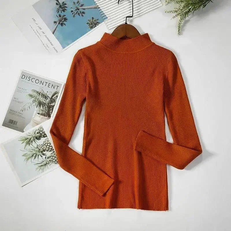 Rust orange ribbed turtleneck sweater for women, long sleeve fashion top on hanger with magazine backdrop