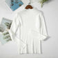 White ribbed turtleneck sweater for women, long sleeve fashion top on hanger with magazine backdrop