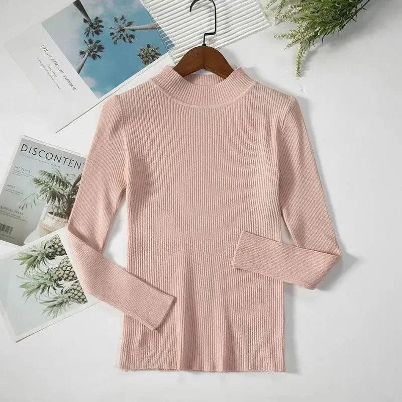 Pink ribbed turtleneck sweater for women, long sleeve fashion top on hanger with magazine decor
