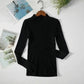 Black ribbed turtleneck sweater for women, long sleeve fashion top on hanger