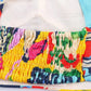 Colorful smocked women's top with vibrant abstract print and elasticated detail