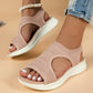 Pink knit women's sandals with white sole, ankle strap, paired with denim shorts for casual summer fashion