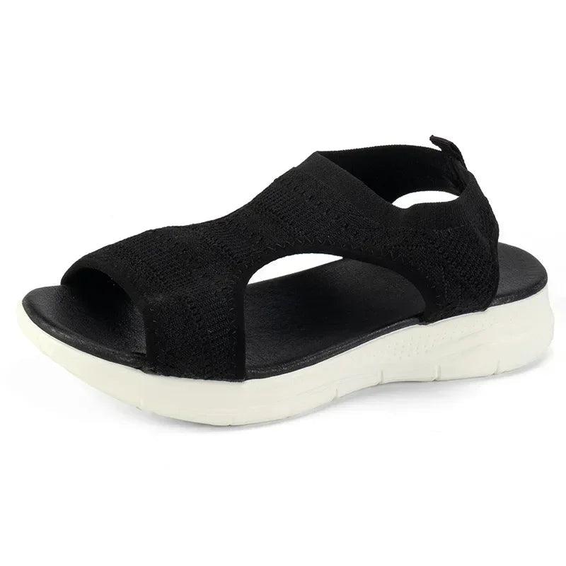 Black women's casual sandals with white sole, breathable knit straps, and comfortable design for everyday wear