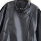 Black women's leather jacket with asymmetrical zip and textured finish, perfect for fashion-forward styles.