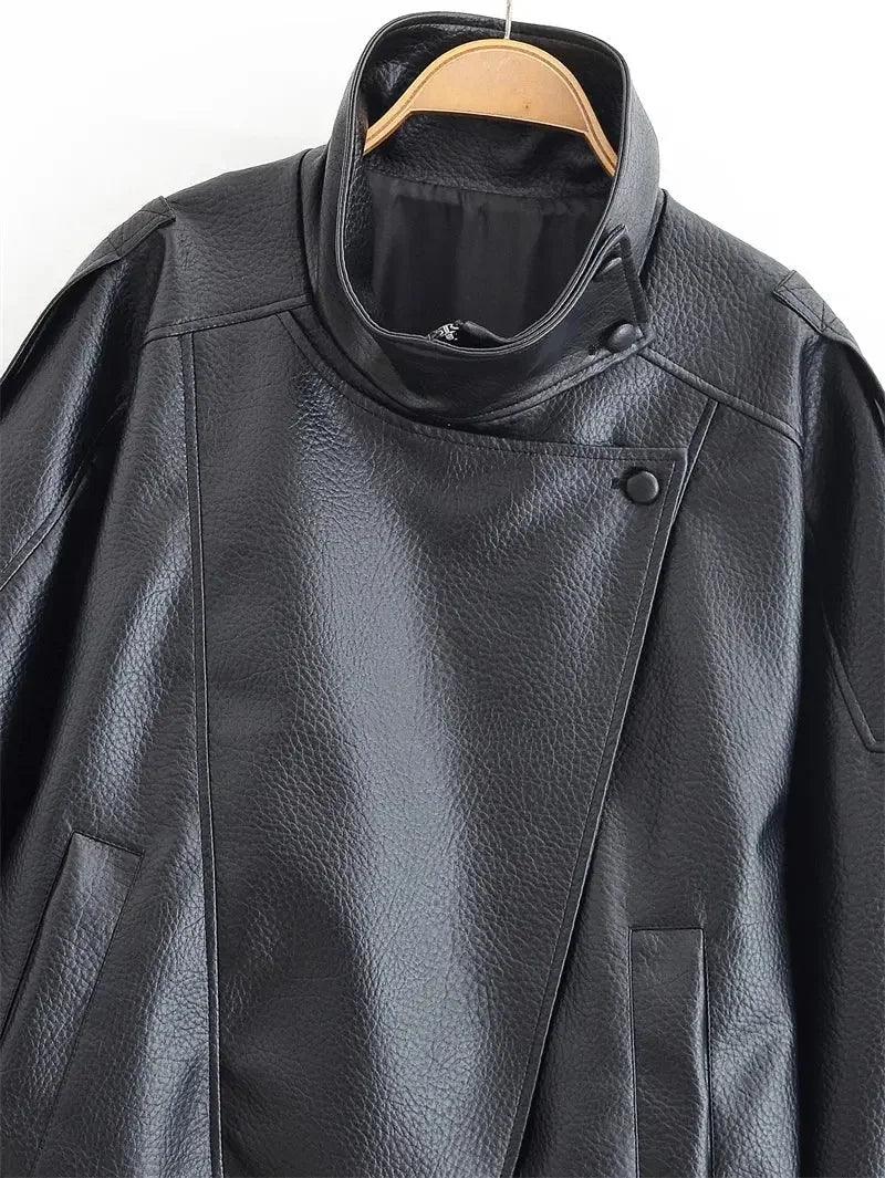 Black women's leather jacket with asymmetrical zip and textured finish, perfect for fashion-forward styles.