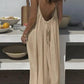 Beige backless maxi dress with tie detail, perfect for summer fashion and beach style.