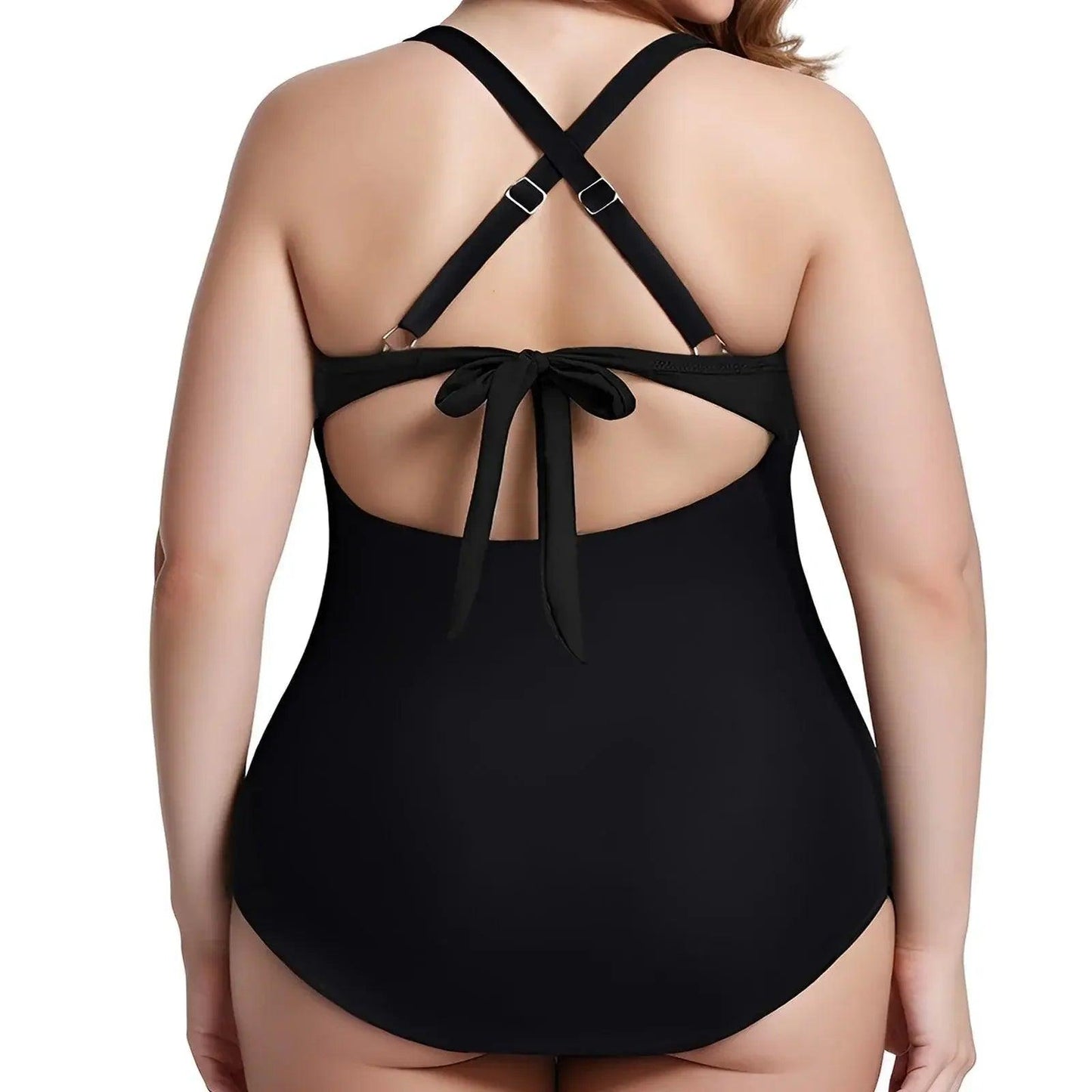 Black one-piece swimsuit with crisscross back straps and tie detail, plus size women's swimwear