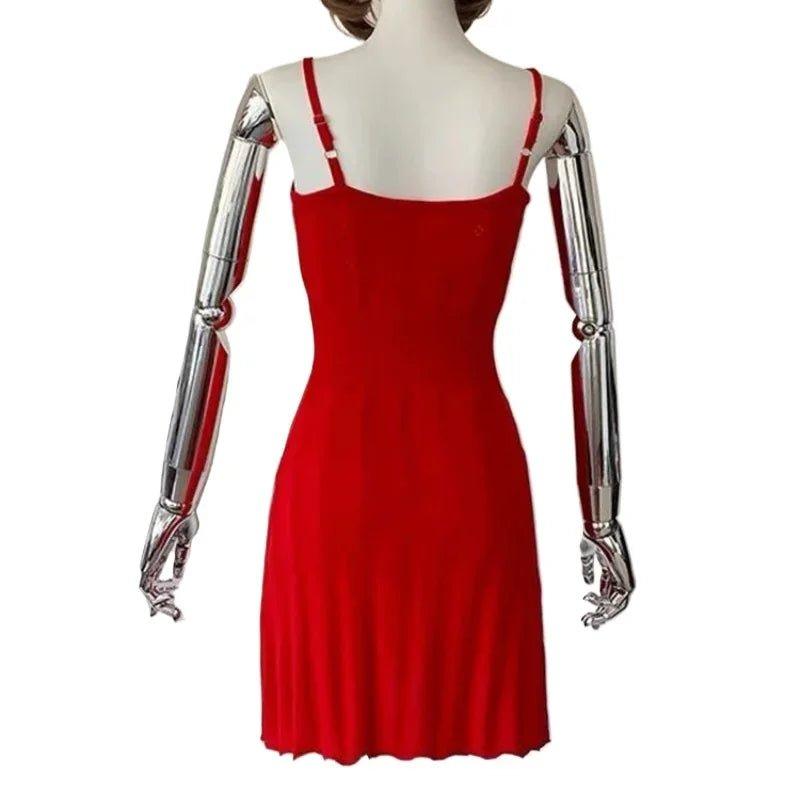 Red spaghetti strap dress on mannequin with metallic arms, women's fashion