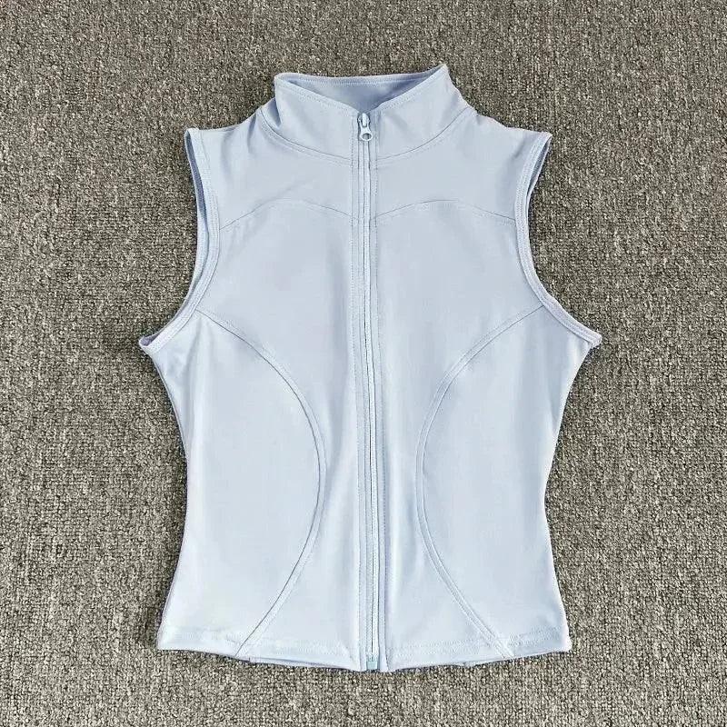 Light blue sleeveless women's fitness vest with full zipper, ideal for gym workouts and active wear
