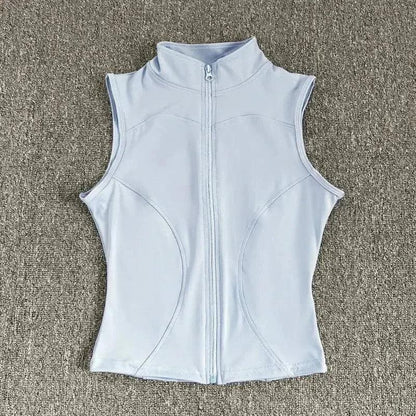 Light blue sleeveless women's fitness vest with full zipper, ideal for gym workouts and active wear