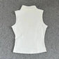 White sleeveless women's top with high neck and fitted back, ideal for fashion and beauty styles