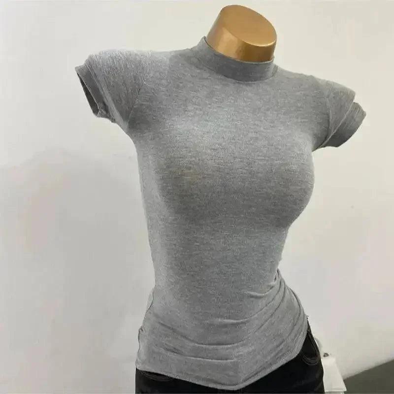 Gray women's fitted short sleeve top with mock neck, displayed on mannequin for fashion styling