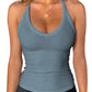Woman wearing blue ribbed V-neck tank top, fitness fashion, stylish activewear