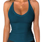 Teal ribbed women's tank top with racerback, perfect for gym or casual wear, paired with black leggings.