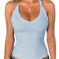 Light blue ribbed women's tank top with V-neck, paired with jeans and gold necklace