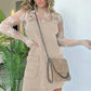 Woman in lace top and beige corduroy overall dress with chain strap bag, fashion outfit