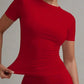 Woman in red fitted short sleeve top and matching pants, stylish fashion outfit