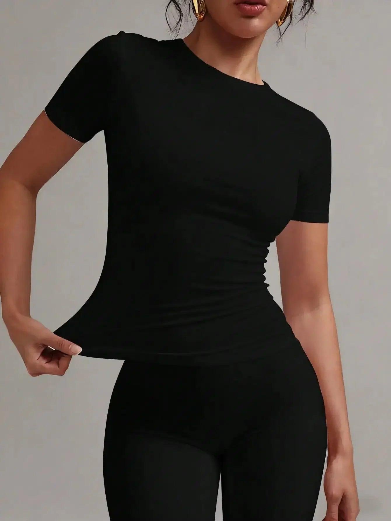 Black ruched short sleeve top for women, stylish fashion fit with gold hoop earrings
