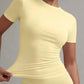 Yellow women's fitted short sleeve top with ruched side detail, stylish fashion apparel
