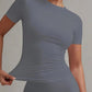 Gray women's fitted short sleeve top with ruched side detail, fashion activewear